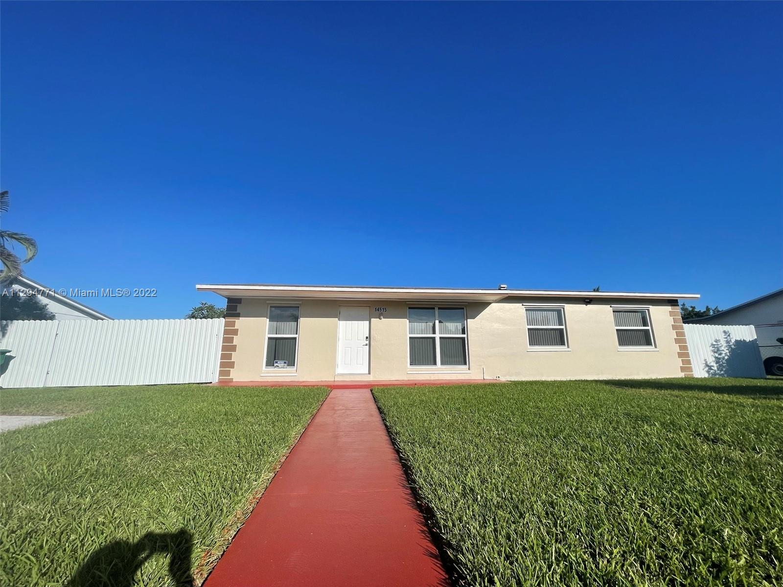 14515 Southwest 105th Court Miami, FL 33176 - Photo 29 of 30 a view of a house with a yard