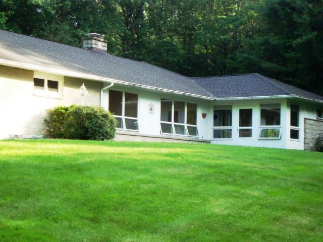 77 Obtuse Hill Road Brookfield, CT 06804 - Photo 1 of 1 a view of a house with backyard and garden