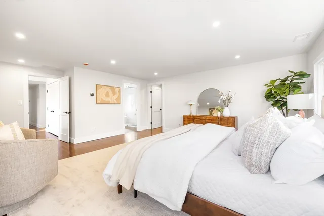 a bedroom with a bed and a couch