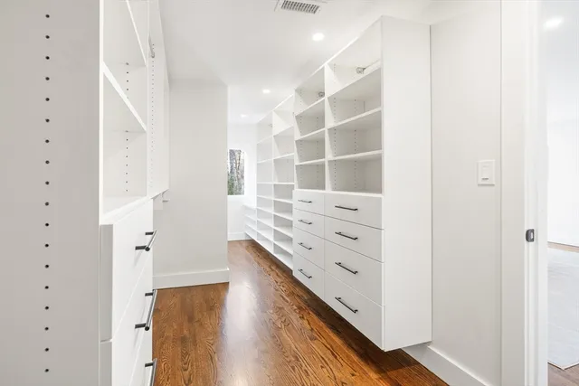 a view of walk in closet with white walls