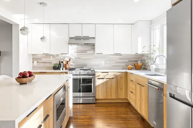 a kitchen with a stove a sink and a refrigerator