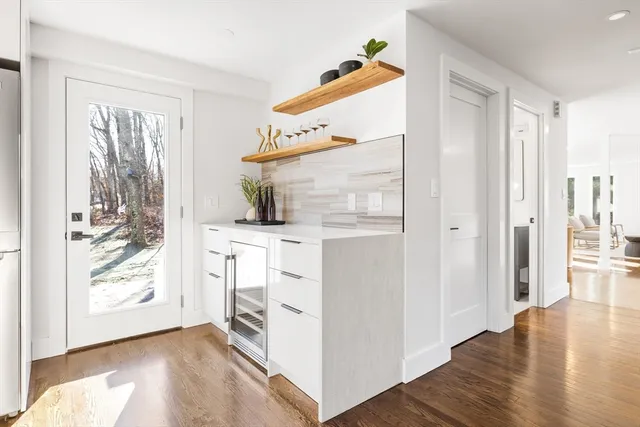 a view of kitchen with furniture and wooden floor