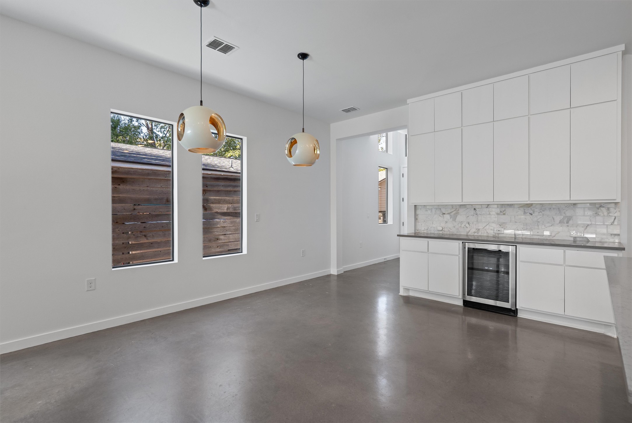 1107 Taulbee Lane, Unit B Austin, TX 78757 - Photo 5 of 37 Dining room with beverage fridge and tons of storage