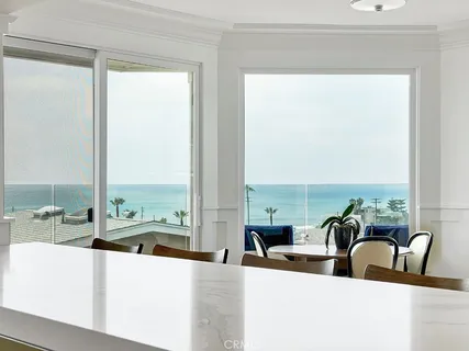 a kitchen with a stove and white cabinets
