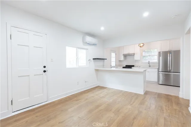 a view of kitchen with wooden floor