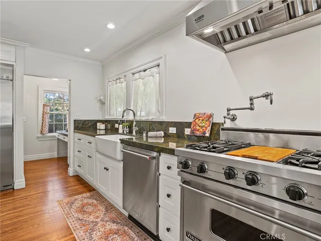 a dining room with kitchen island a dining table and chairs