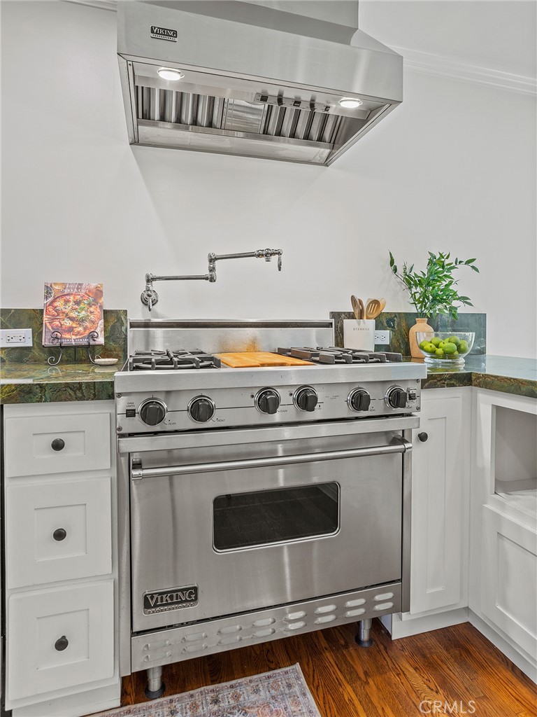 10404 Margate Street North Hollywood, CA 91601 - Photo 17 of 62 a white stove top oven sitting inside of a kitchen