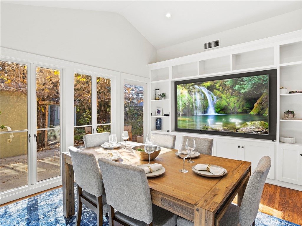 10404 Margate Street North Hollywood, CA 91601 - Photo 22 of 62 a dining room with furniture a large window and a table