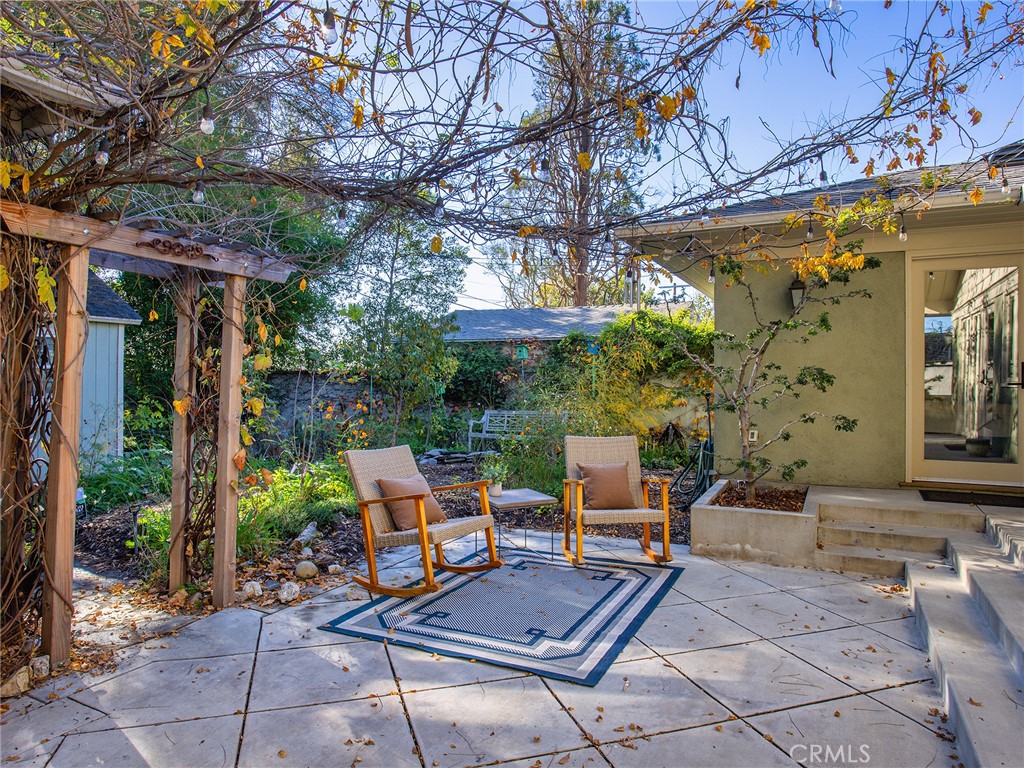10404 Margate Street North Hollywood, CA 91601 - Photo 48 of 62 a view of backyard with outdoor seating and trees