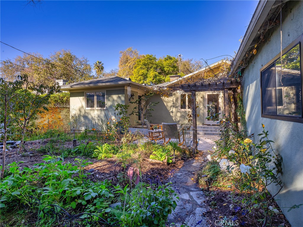 10404 Margate Street North Hollywood, CA 91601 - Photo 54 of 62 a view of a house with a yard and garden
