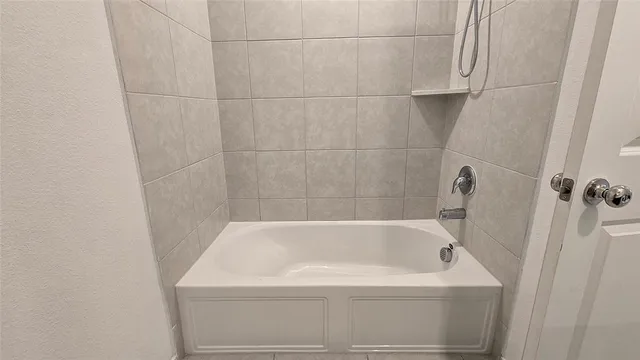 a bathroom with a bathtub