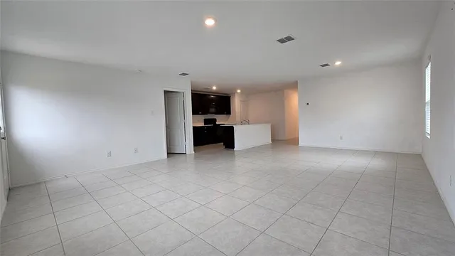 a view of an empty room with window