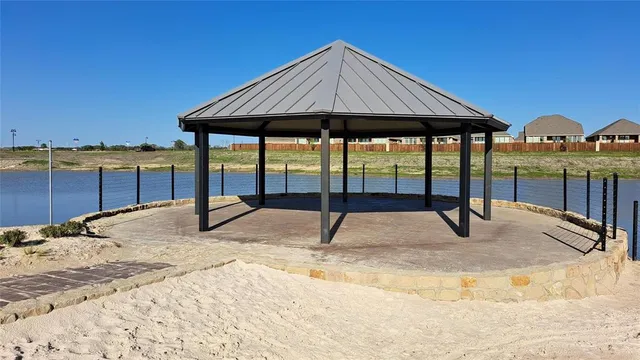 a swimming pool with outdoor seating and yard