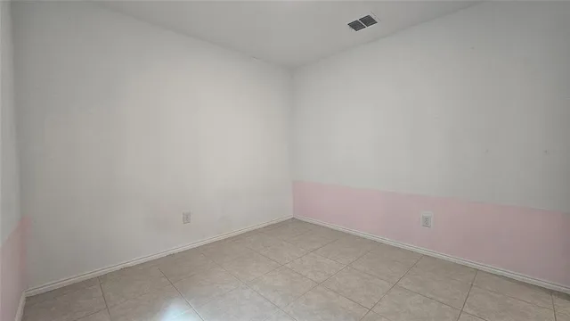 an empty room with closet area