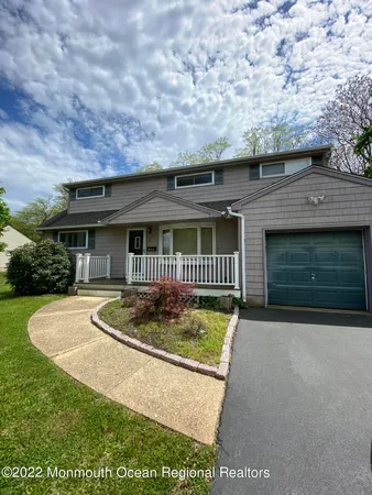 a front view of a house with yard