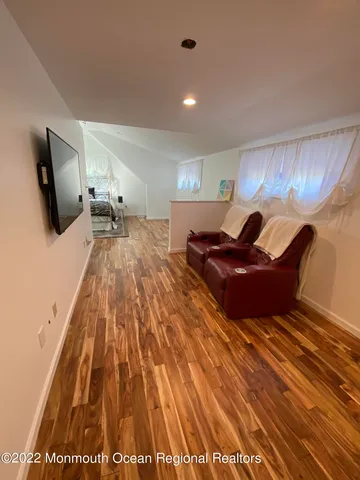 a living room with a couch and a flat screen tv