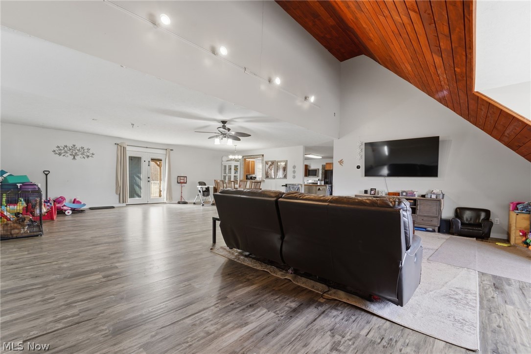 3913 Ninevah Road Ashtabula, OH 44004 - Photo 10 of 37 Living area featuring wood finished floors, a vaulted wooden ceiling, and ceiling fan