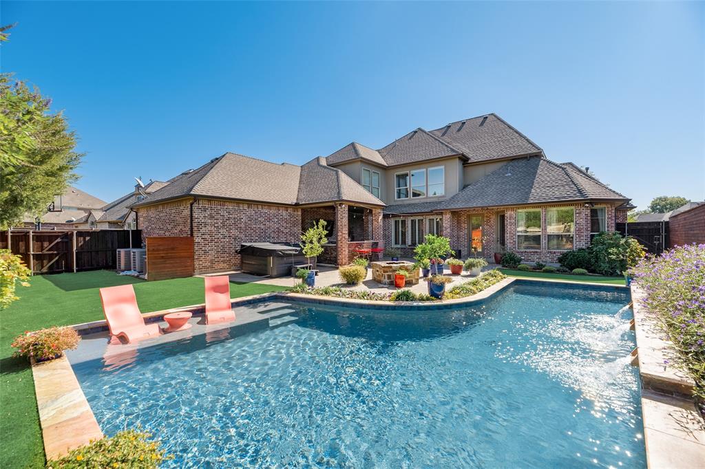 3600 Braewood Drive McKinney, TX 75072 - Photo 1 of 38 a front view of a house with swimming pool garden and patio