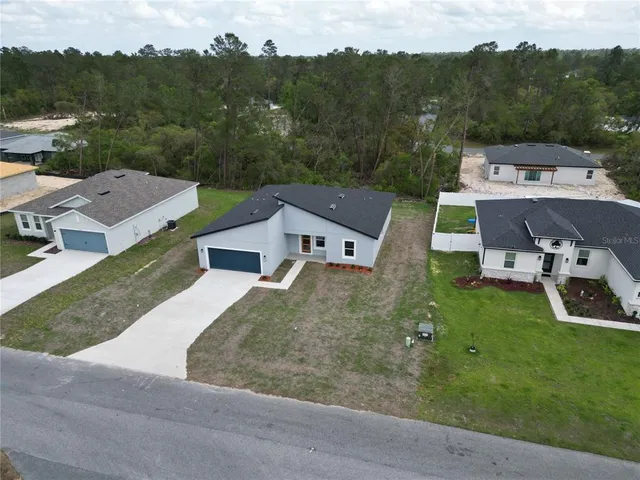an aerial view of a house with a garden
