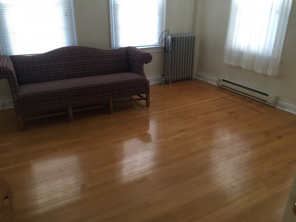 112 Main Street, Unit A Upton, MA 01568 - Photo 5 of 12 a view of livingroom with furniture and a window