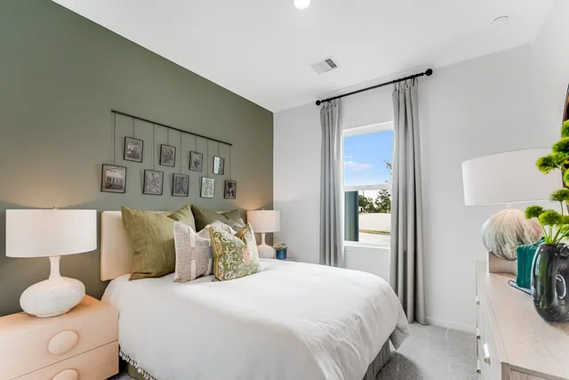 a bedroom with a bed and a dresser