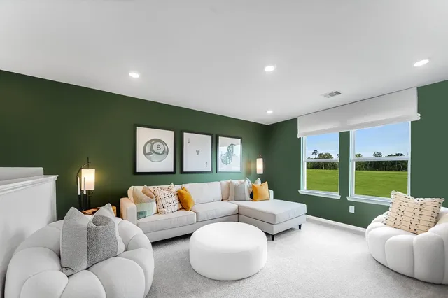 a view of a swimming pool with a patio and a backyard