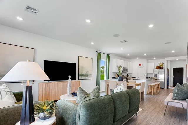 a view of a livingroom with furniture and front door