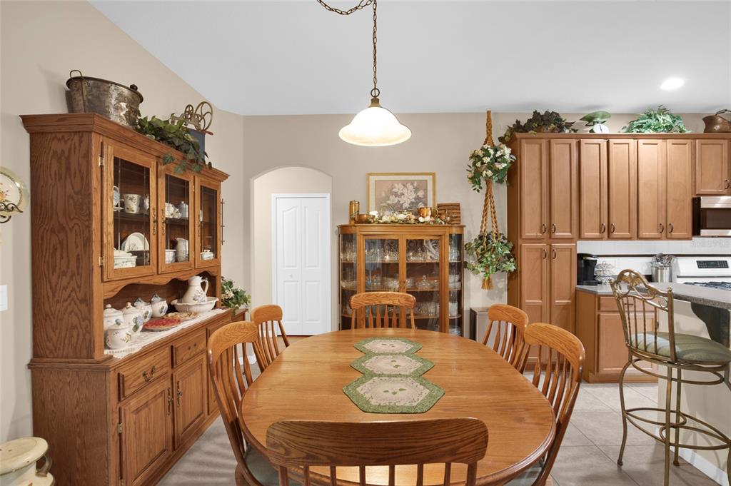 16411 Southwest 14th Avenue Road Ocala, FL 34473 - Photo 25 of 59 a view of a dining room with furniture