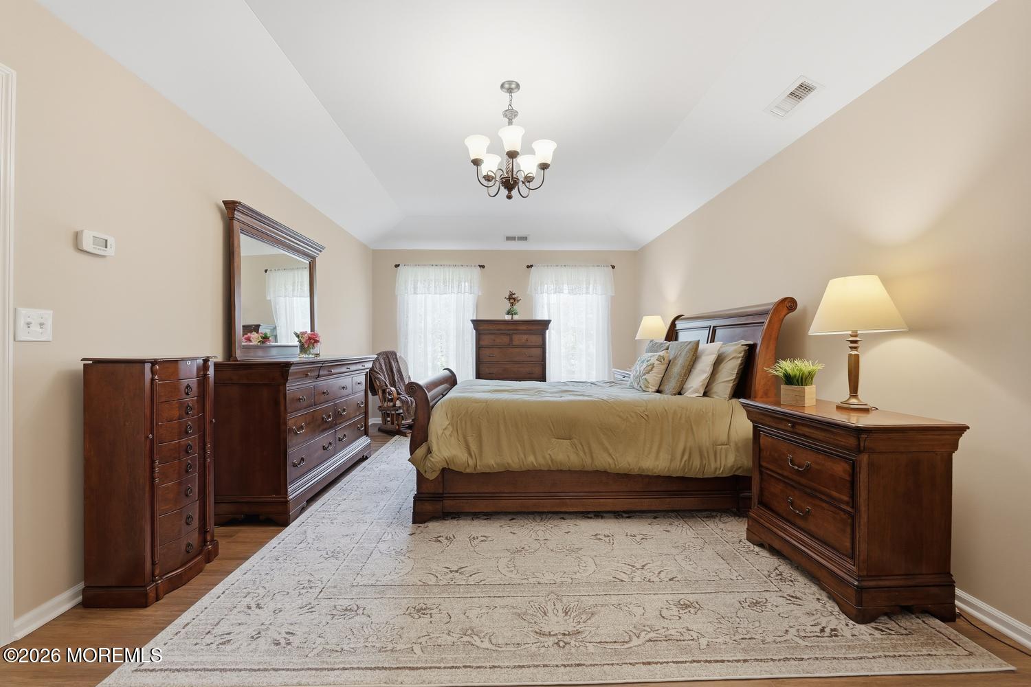 7 Cherry Tree Lane Cream Ridge, NJ 08514 - Photo 19 of 47 a spacious bedroom with a bed dresser and wooden floor
