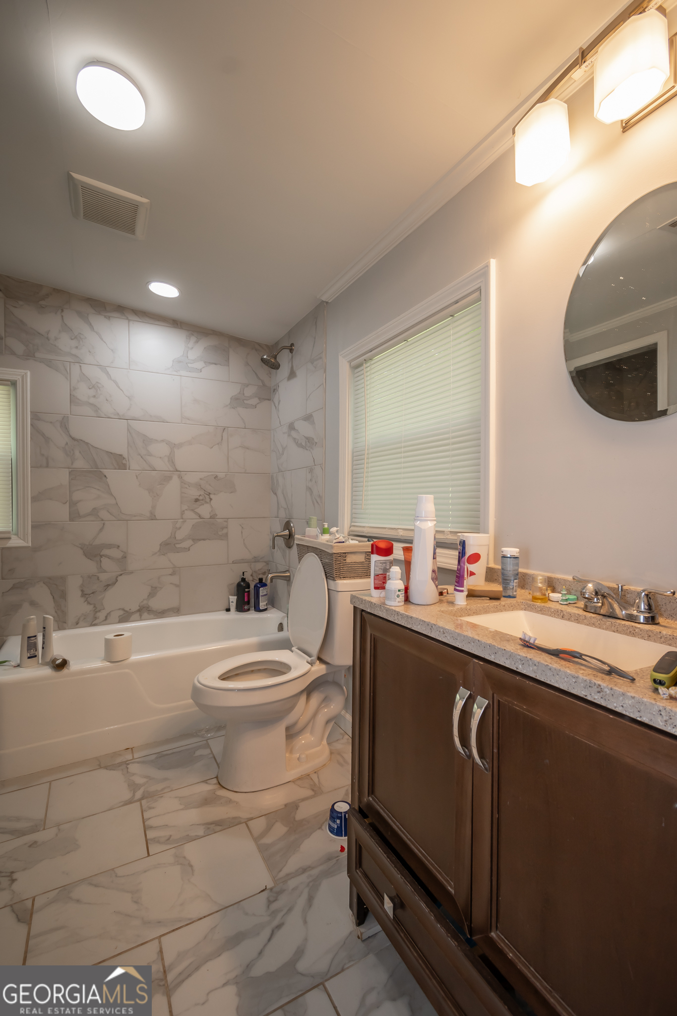 120 Hillside Street Athens, GA 30601 - Photo 9 of 18 a bathroom with a sink a toilet and a mirror