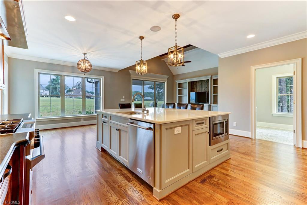 6861 Matzinger Court Oak Ridge, NC 27310 - Photo 12 of 30 Kitchen with view to Breakfast Area and Keeping Room