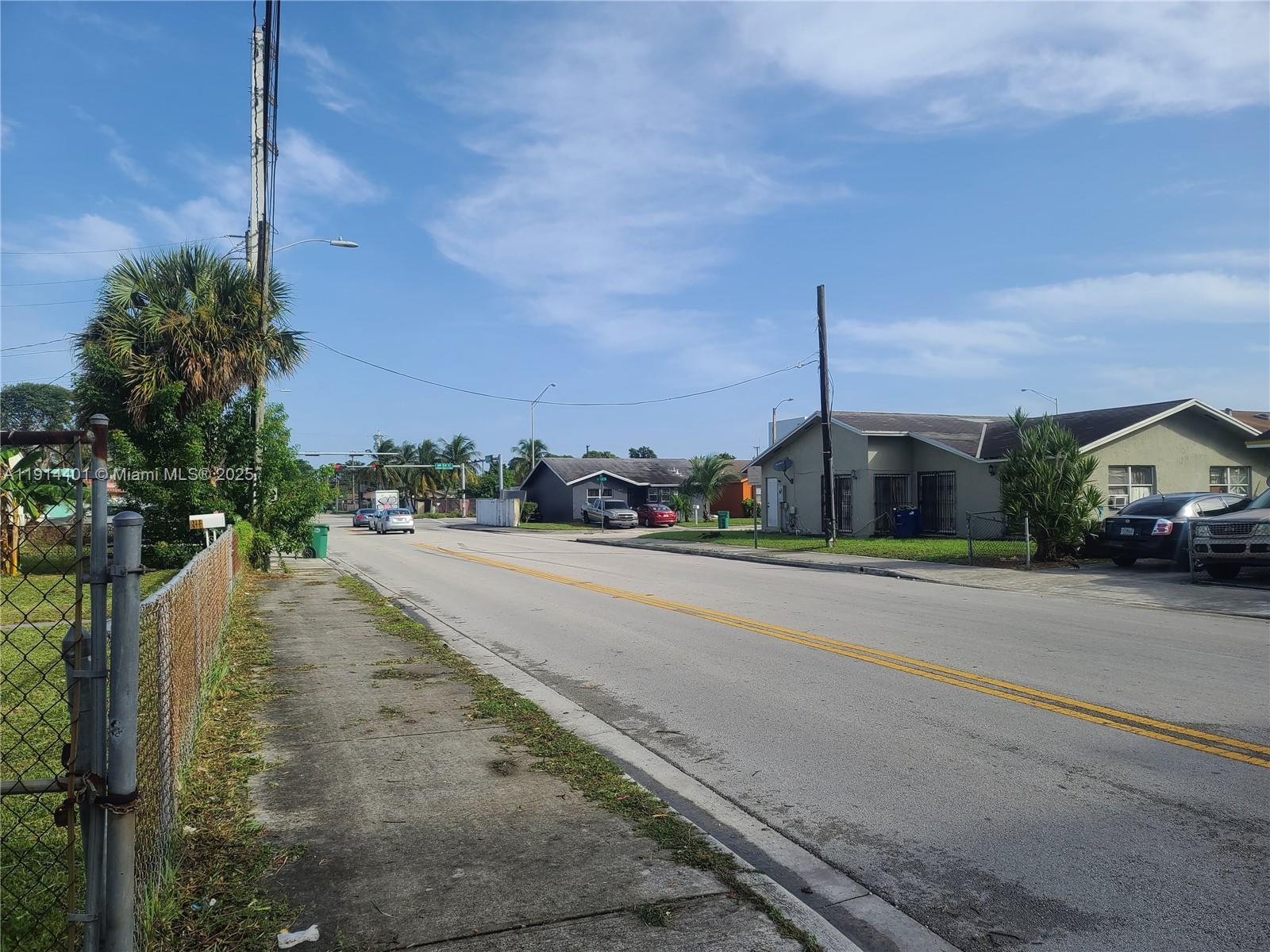 5364 Northwest 29th Avenue Miami, FL 33142 - Photo 3 of 4 a view of a street with cars parked