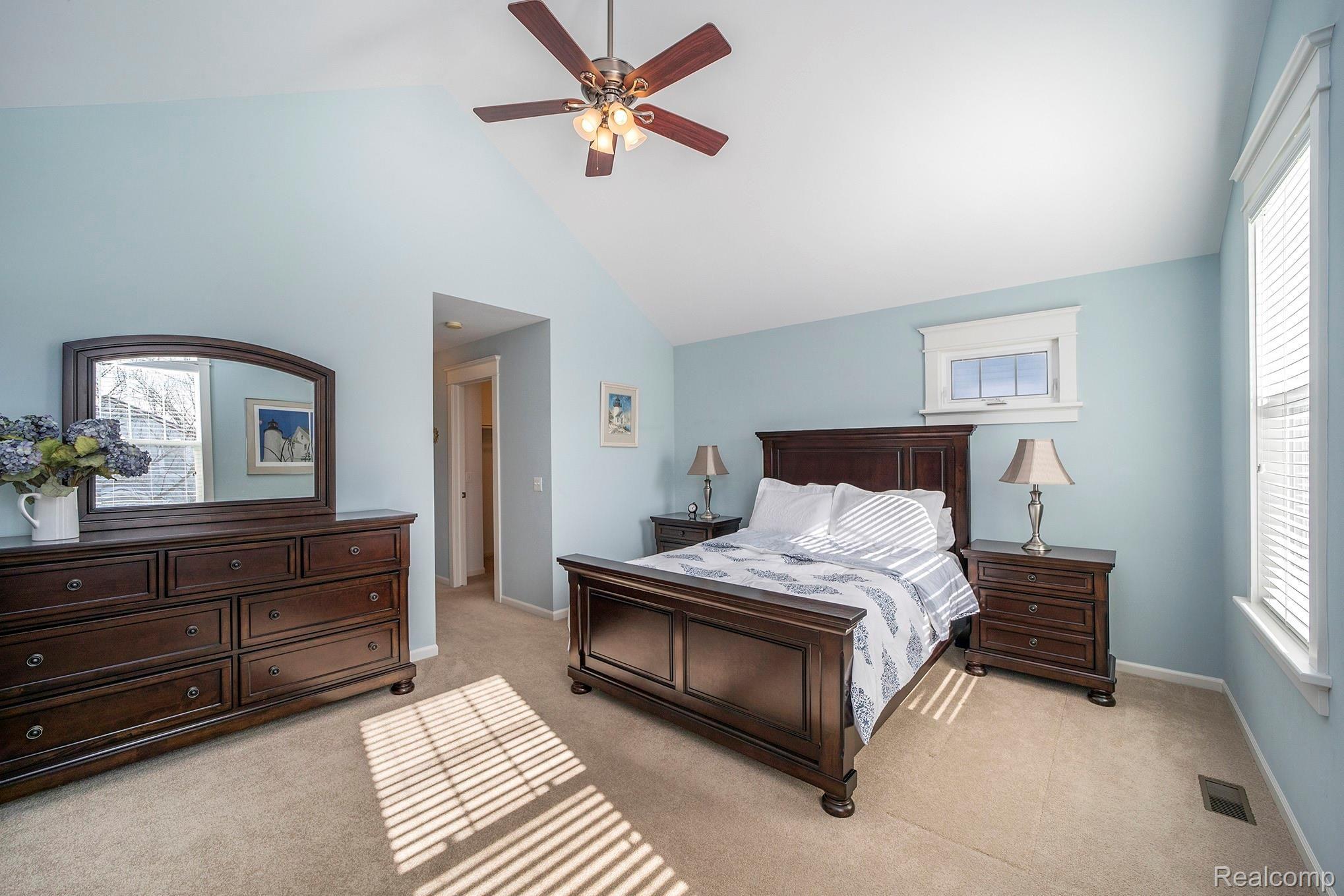 937 Ruffner Avenue Birmingham, MI 48009 - Photo 16 of 39 The owner’s en suite is richly appointed with cathedral ceilings, walk-in & linen closets, marble vanity with dual sinks, Euro glass shower & jetted tub with built-in shelving.