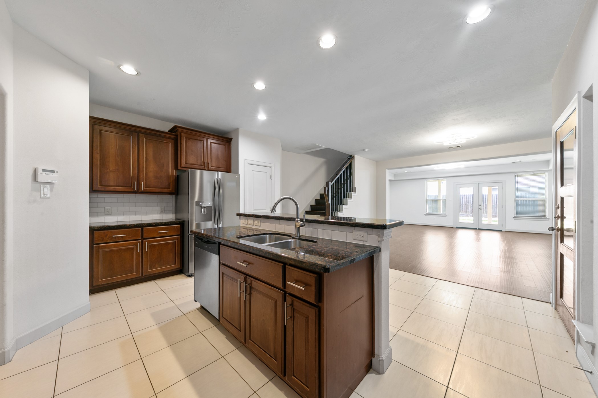 1809 Wichita Street Houston, TX 77004 - Photo 11 of 32 a kitchen with stainless steel appliances granite countertop a stove a sink and a refrigerator