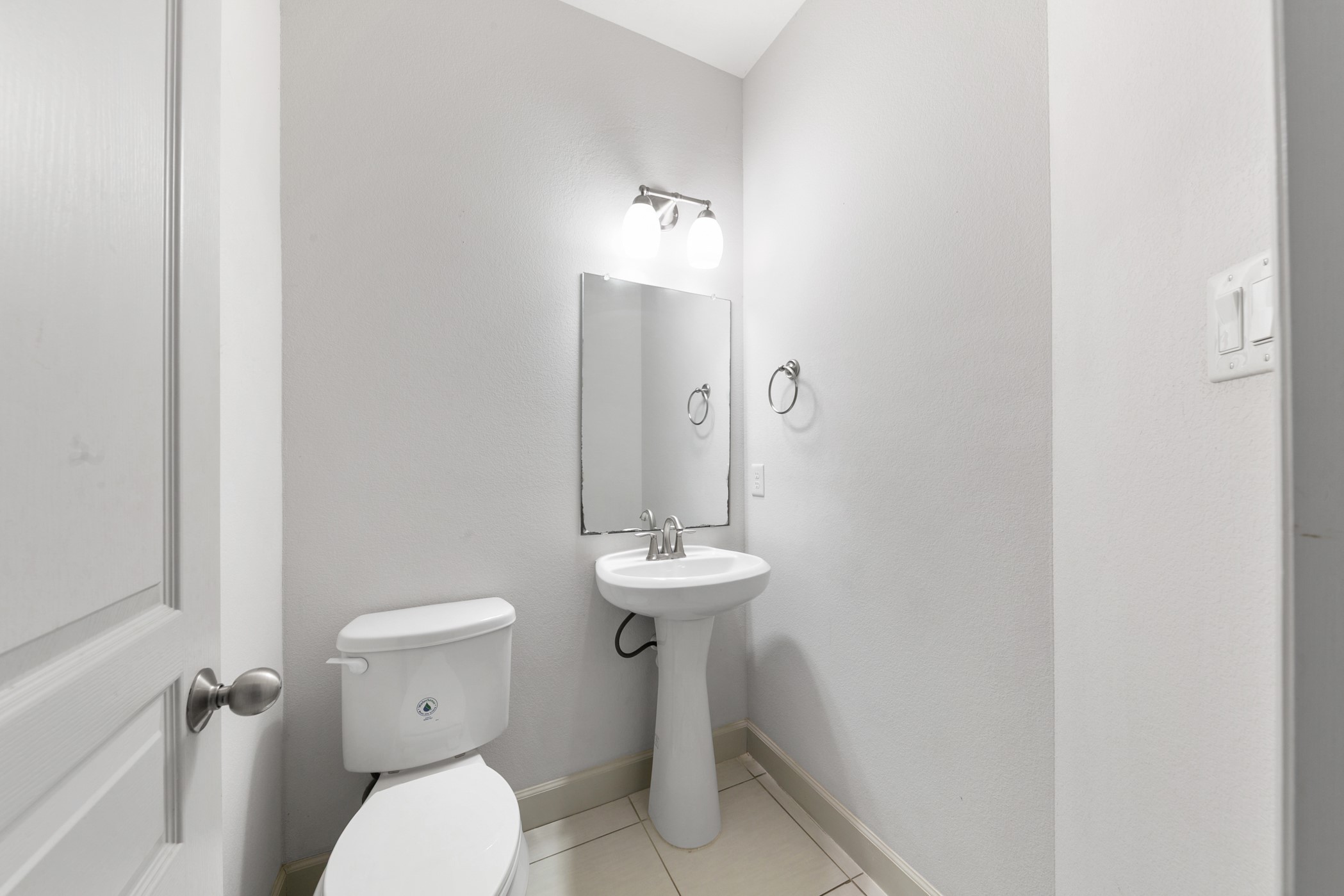 1809 Wichita Street Houston, TX 77004 - Photo 12 of 32 a bathroom with a toilet sink and mirror