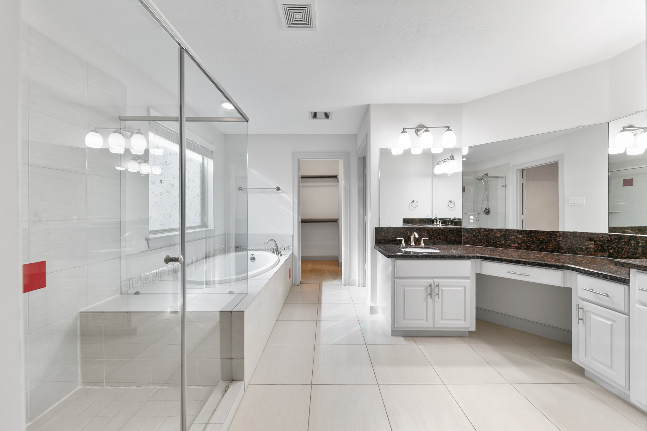 1809 Wichita Street Houston, TX 77004 - Photo 15 of 32 a large bathroom with a sink a large mirror and a shower