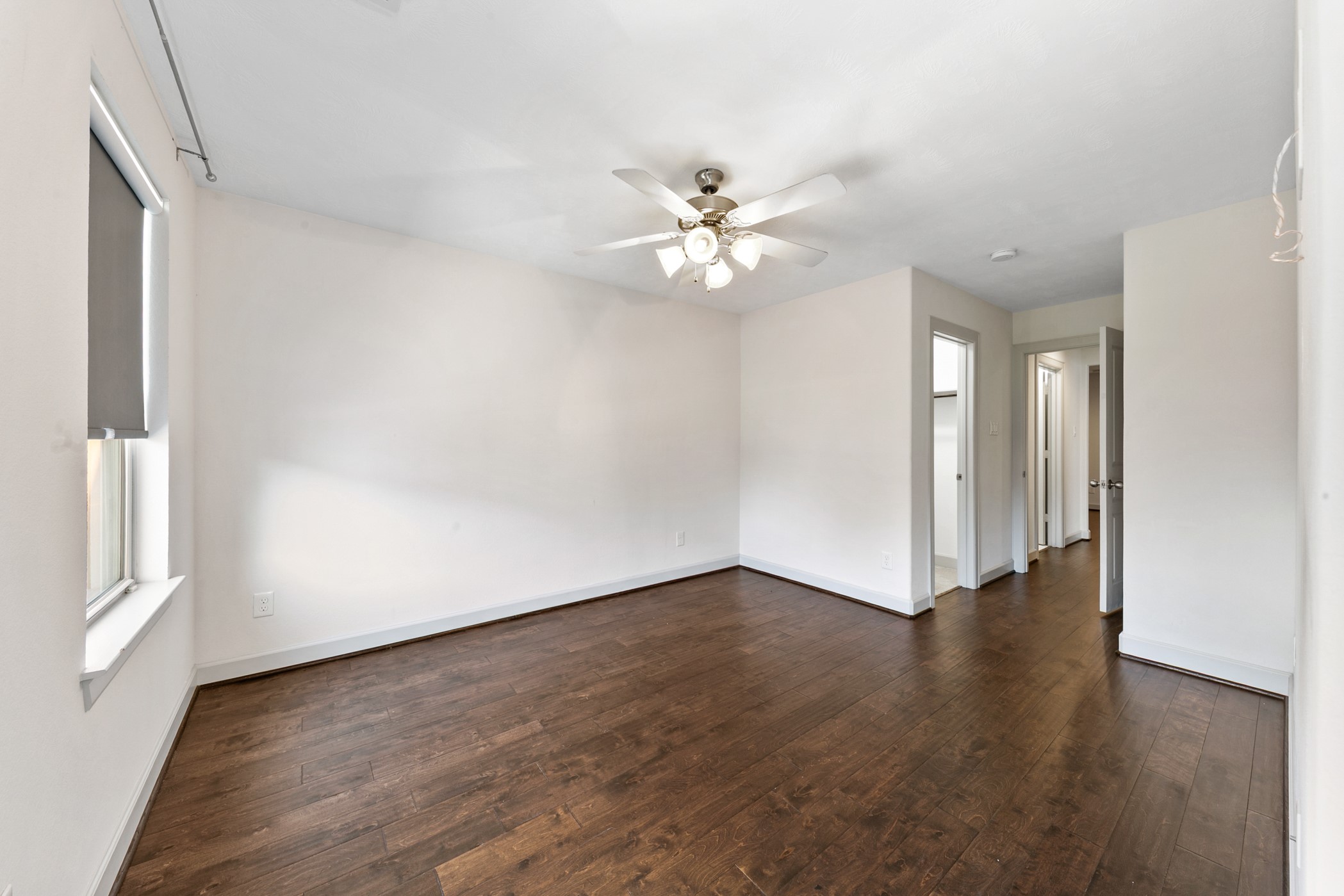 1809 Wichita Street Houston, TX 77004 - Photo 28 of 32 wooden floor in an empty room with a window