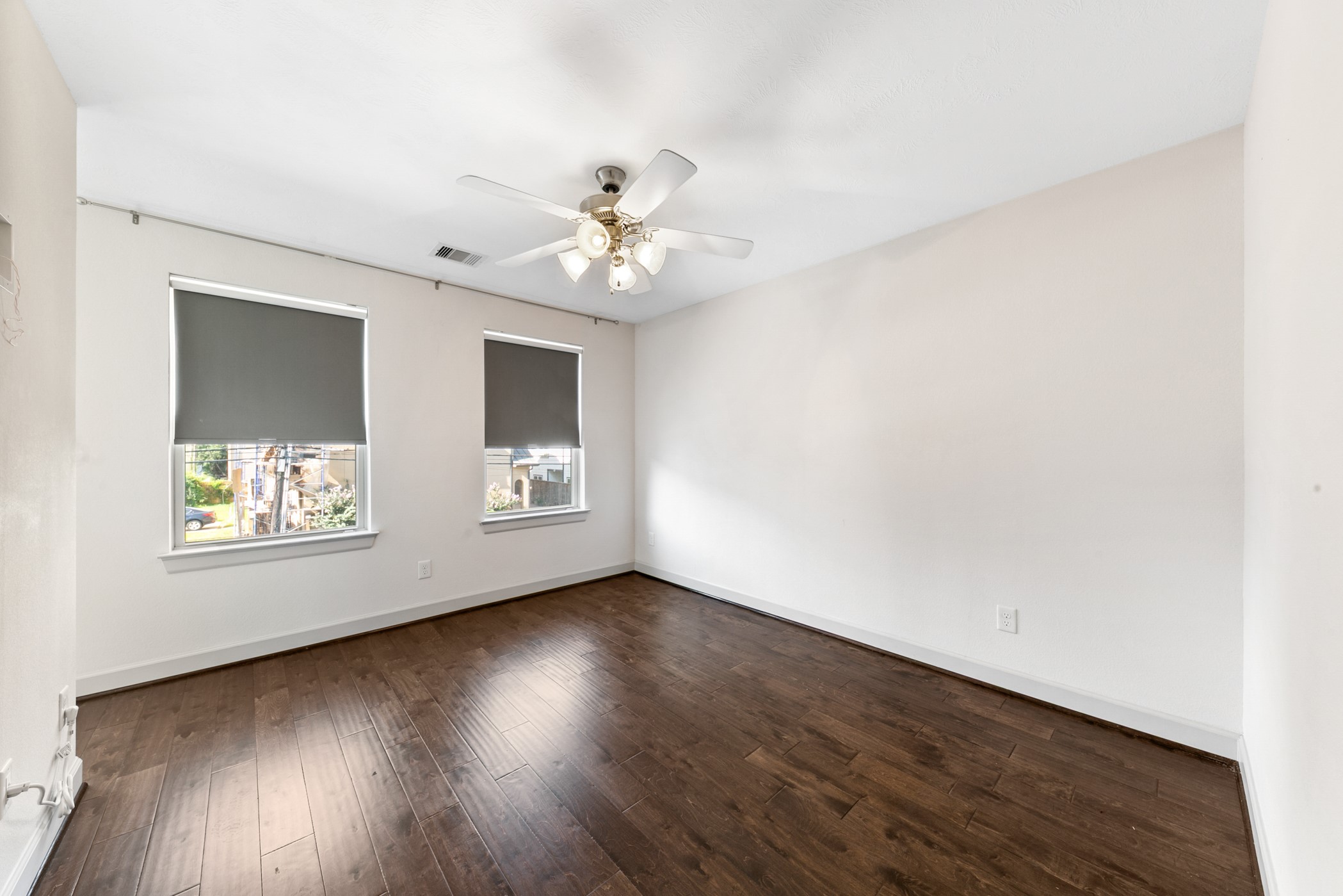 1809 Wichita Street Houston, TX 77004 - Photo 29 of 32 an empty room with wooden floor and windows