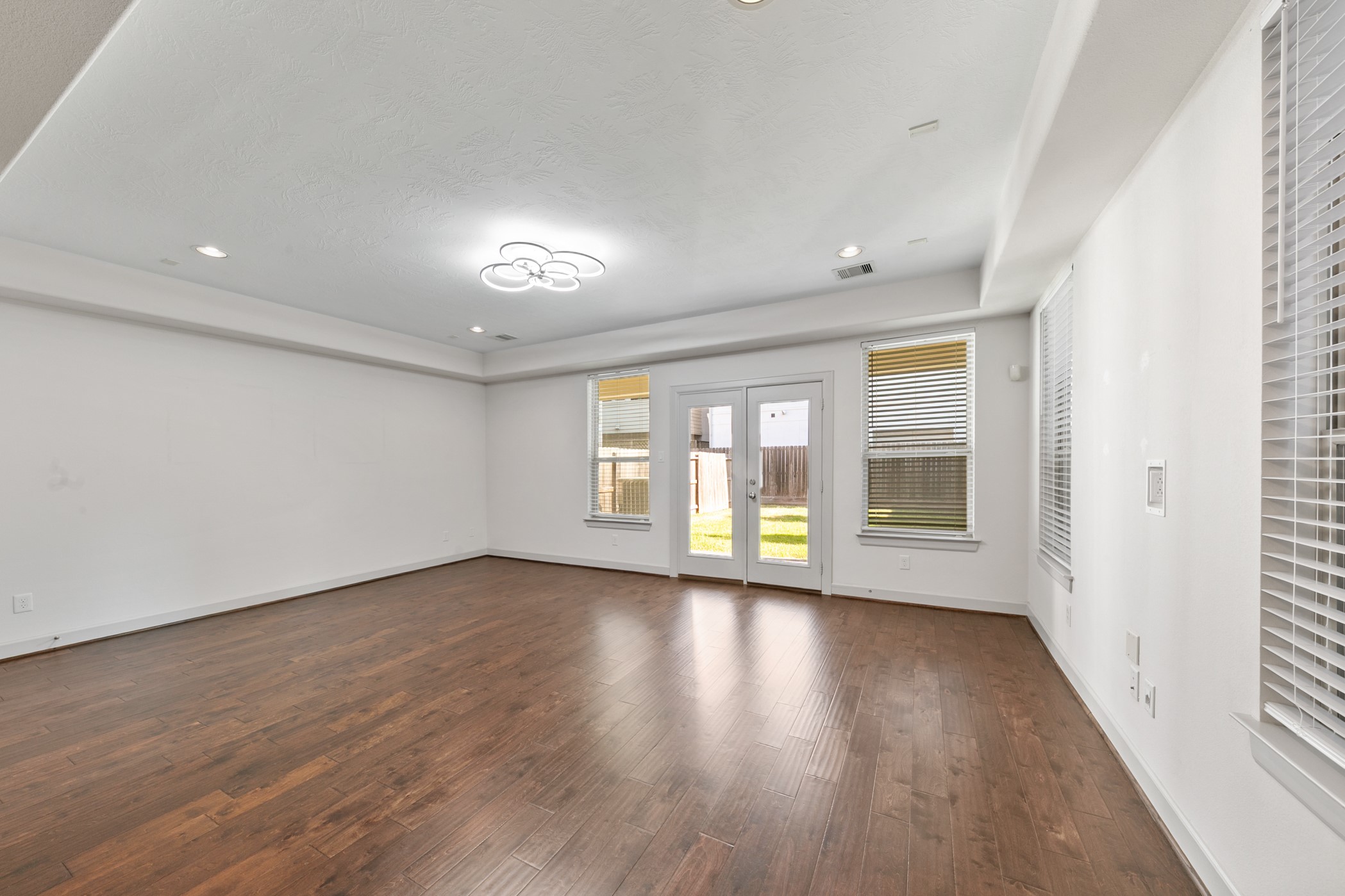 1809 Wichita Street Houston, TX 77004 - Photo 7 of 32 a view of an empty room with wooden floor and a window