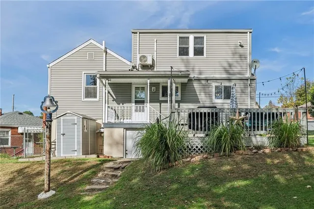 a view of a house with a yard and plants