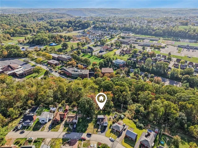 an aerial view of residential house with parking space
