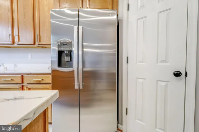 a view of an empty room with closet area