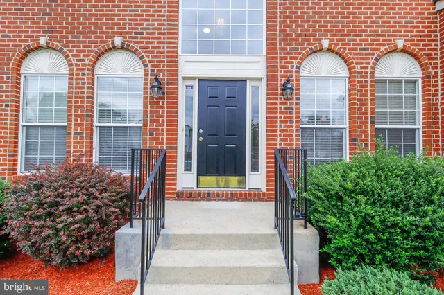 a view of an empty room and wooden floor