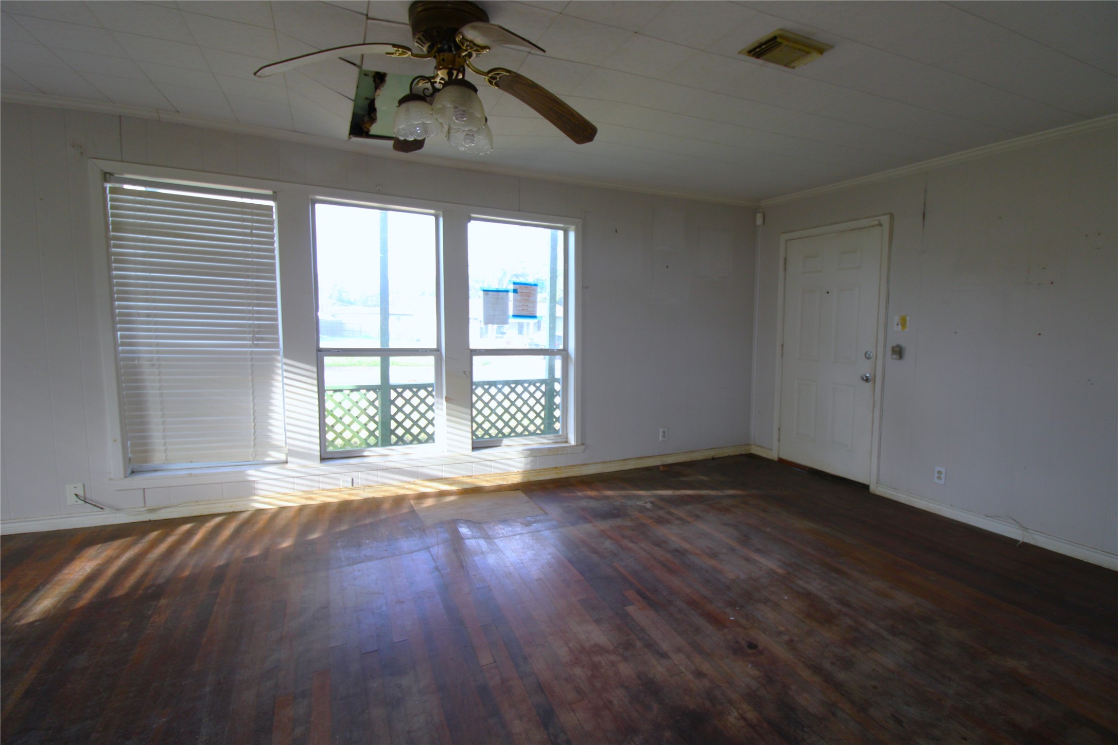 430 Winding Way Street Lake Jackson, TX 77566 - Photo 19 of 38 a view of an empty room with wooden floor and a window