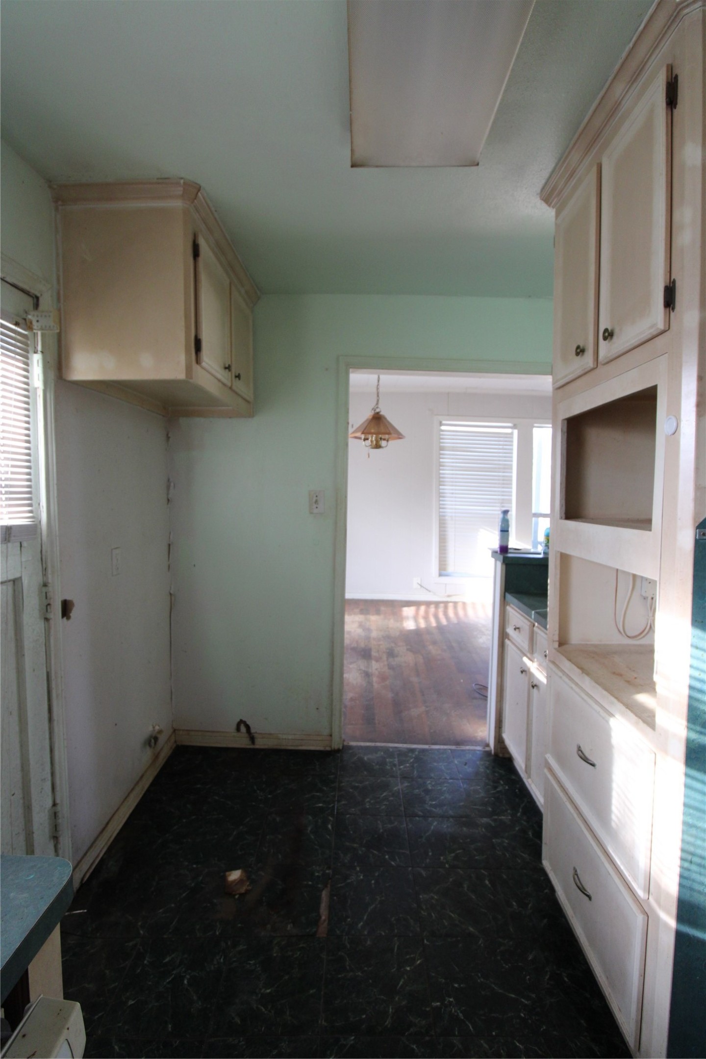 430 Winding Way Street Lake Jackson, TX 77566 - Photo 22 of 38 a view of a kitchen with an empty space and a window