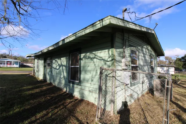 a black white building with a black door