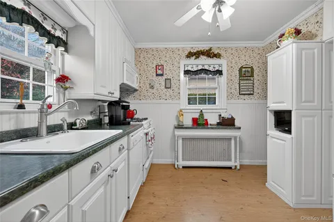 a kitchen with stainless steel appliances a sink and a stove
