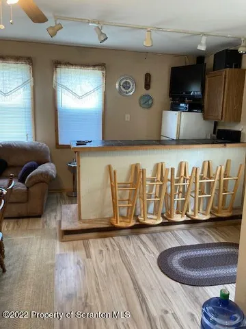 a view of walk in closet with clothes