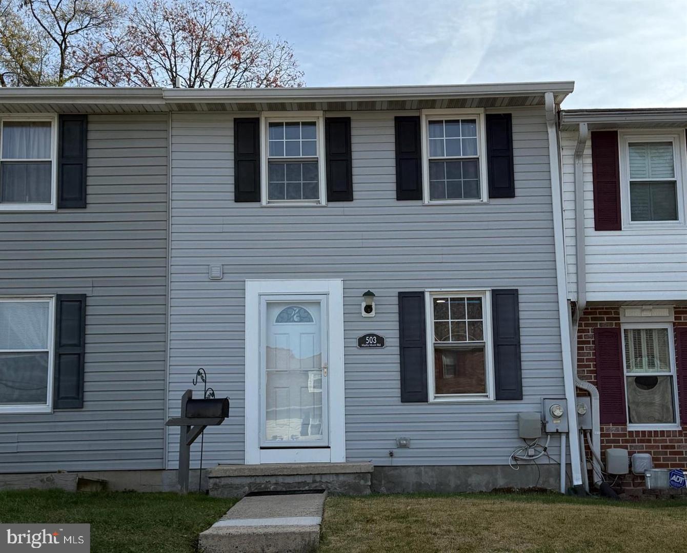 Charming townhouse with inviting entry.