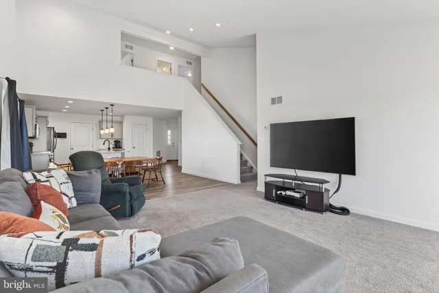 a bedroom with a bed dresser and a window